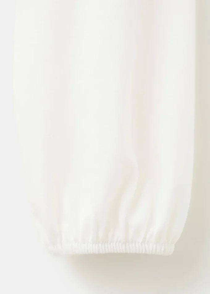 Bavlněné tričko se shromážděným lemem Bavlněné tričko se shromážděným lemem