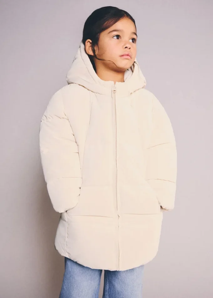 Dlouhá vycpaná bunda s kapucí Dlouhá vycpaná bunda s kapucí