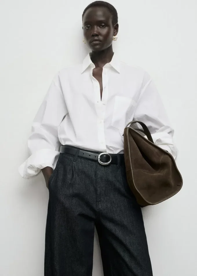 Džínové kalhoty se širokými nohavicemi a puky Džínové kalhoty se širokými nohavicemi a puky