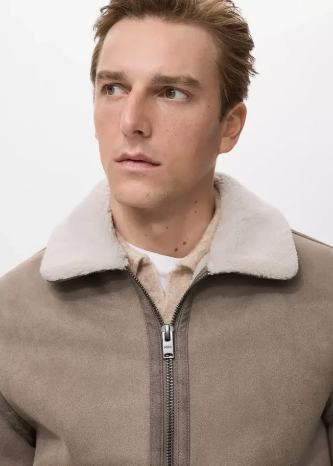 Oboustranná bunda s detaily z ovčí kůže Oboustranná bunda s detaily z ovčí kůže